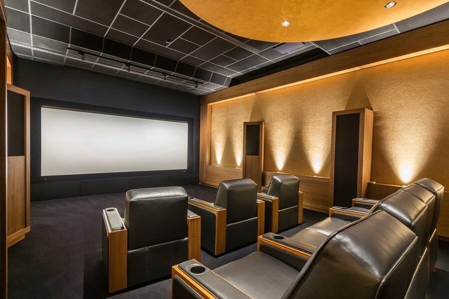  A high-end cinema featuring an upgraded home theater design and setup.