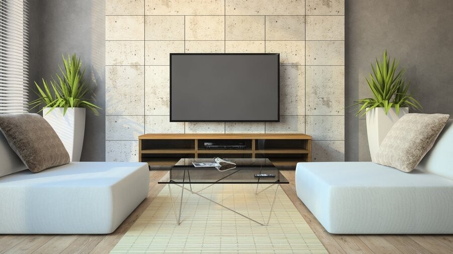 Media living space with TV mounted on the wall.