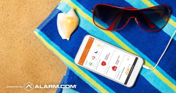 Alarm.com interface on cellphone on beach towel