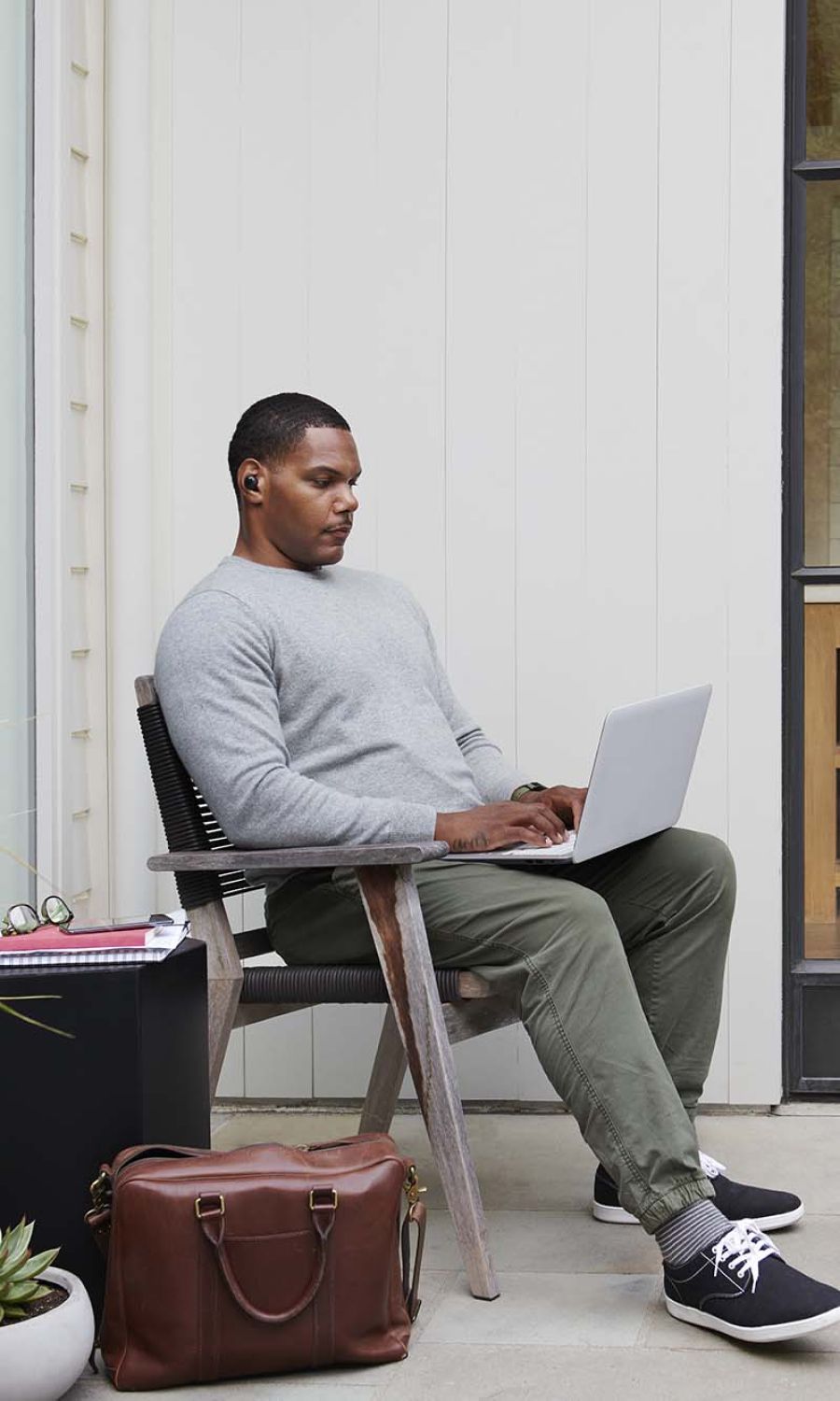 Man plugging wifi into wall