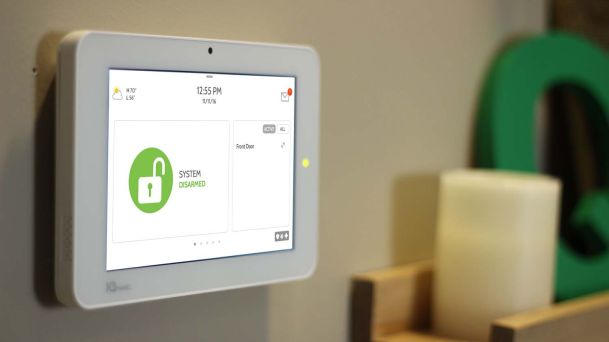 qolsys touchpad on wall with disarmed system