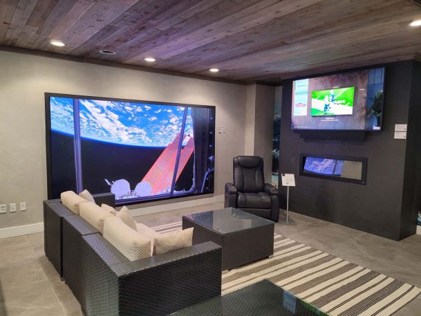 Samsung TV on wall, wooden ceiling